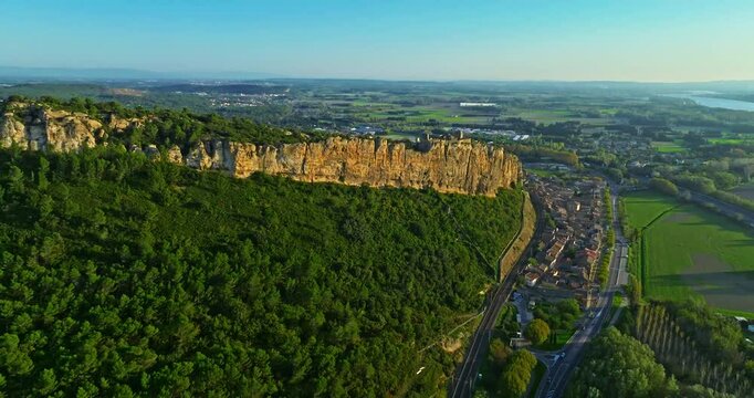 Mornas Fortress stands majestically on top of a rocky cliff. The Fortress of Mornas is a medieval fortress above the village of the same name in the French department of Vaucluse