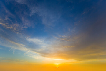 dramatic sunset on blue cloudy sky background