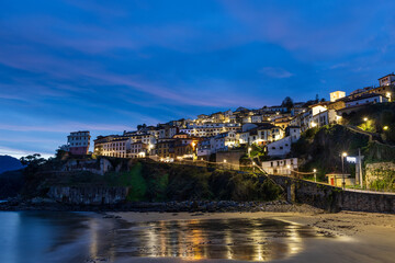 Night view of Lastres from the beach. Asturias, northern Spain.