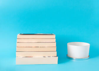 stack of books on blue background
