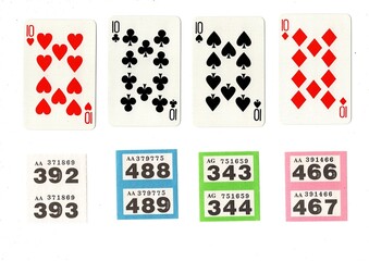 Vintage playing cards and raffle tickets isolated on a white background.