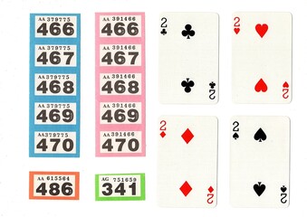Vintage playing cards and raffle tickets isolated on a white background.