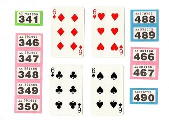 Vintage playing cards and raffle tickets isolated on a white background.