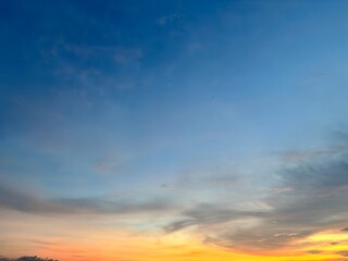 Beautiful sky with natural gradations. Thick clouds in the dusk sky on a winter night. Image of a cloudy sky in the afternoon. View of the night sky with golden light from the evening sun