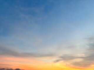 Fototapeta premium Beautiful sky with natural gradations. Thick clouds in the dusk sky on a winter night. Image of a cloudy sky in the afternoon. View of the night sky with golden light from the evening sun