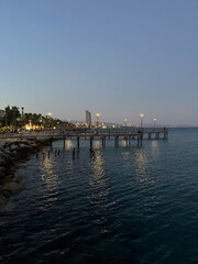 Obraz premium Evening Promenade Lights by the Sea in Cyprus