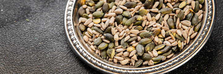 Seed mix pumpkin seeds, sunflower seeds superfood natural food dish organic fresh tasty gourmet food background on the table rustic food top view copy space