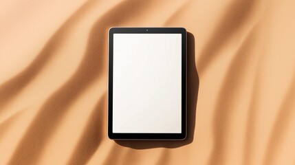 Tablet computer mockup with blank screen on sand background