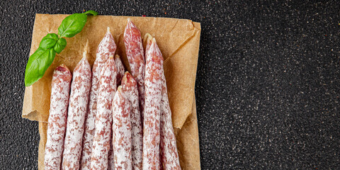 Sausage aperitif salami meat natural food dish organic product fresh tasty gourmet food background on the table rustic food top view copy space