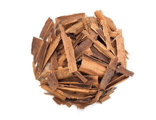 Pile of aromatic cinnamon isolated on white, top view