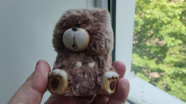 small toy bear. teddy bear figurine.