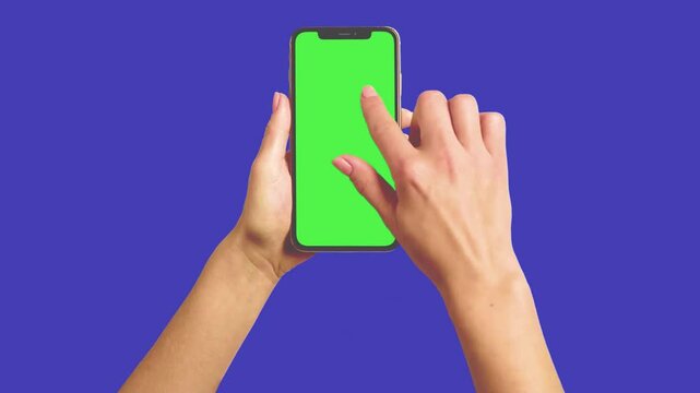Real human hand swiping on a smartphone with a green screen, chroma key a hand holding mobile animated video 3d render realistic footage, real hand swipes left, scrolling down on online app