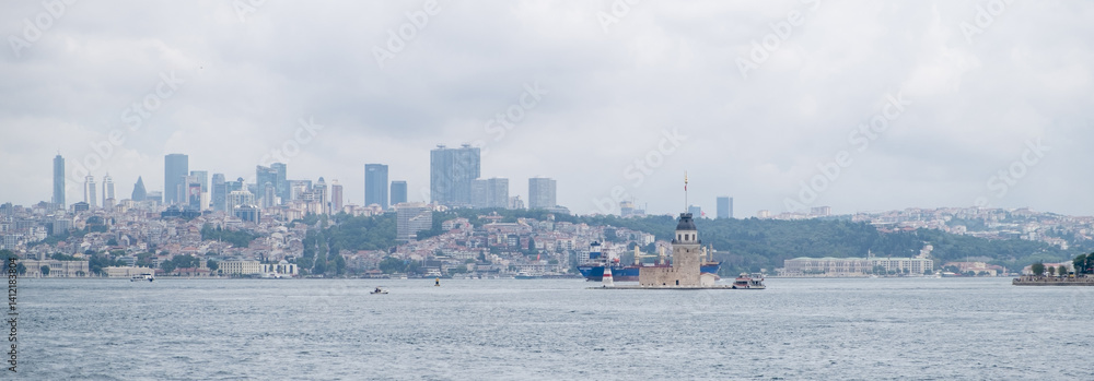 Aufkleber view of the maidens tower in the bosphorus with a panoramic city skyline featuring modern buildings 