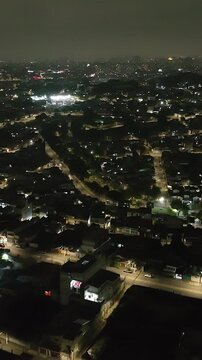 Itaquera neighborhood in S&atilde;o Paulo at night. Aerial view. Vertical video.