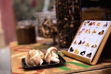 Exhibitor of mushrooms in a village market in Catalonia.