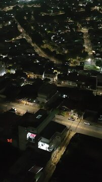 Itaquera neighborhood in S&atilde;o Paulo at night. Aerial view. Vertical video.