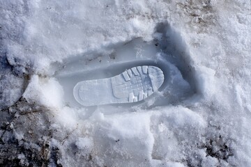 Shoe Print Frozen in Snow Slab A clear boot print perfectly preserved inside a sheet of layered ice
