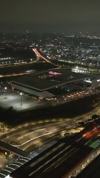 Itaquera neighborhood in S&atilde;o Paulo at night. Aerial view. Vertical video.