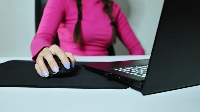 Expressive slow motion woman hand movement in front of laptop during online chat