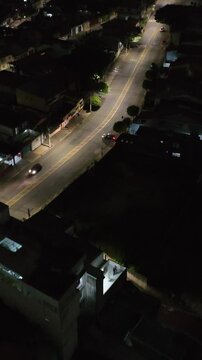 Itaquera neighborhood in S&atilde;o Paulo at night. Aerial view. Vertical video.