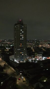 Itaquera neighborhood in S&atilde;o Paulo at night. Aerial view. Vertical video.