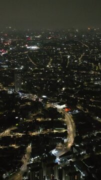Itaquera neighborhood in S&atilde;o Paulo at night. Aerial view. Vertical video.
