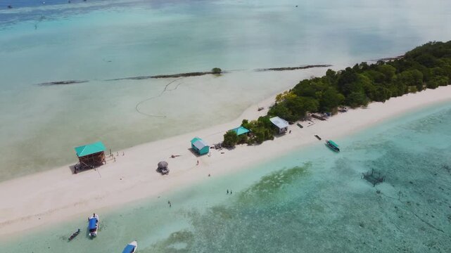 Timba Timba Island off the coast of Borneo, Malaysia. Crystal-clear turquoise waters, white sand beaches, and a pristine tropical paradise seen from above.