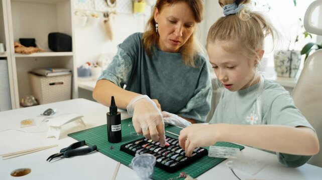 Educational crafting experience where child develops skills through resin art. Jewelry making fosters concentration, problem-solving, and artistic vision, turning creativity into fun learning journey.