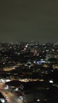 Itaquera neighborhood in S&atilde;o Paulo at night. Aerial view. Vertical video.