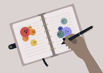 A hand skillfully writes in a stylish journal adorned with colorful mood icons against a minimalist backdrop, encouraging personal reflection and creativity during a quiet moment of self-discovery