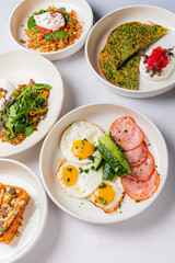 Colorful plates of breakfast items promise a delightful brunch with friends