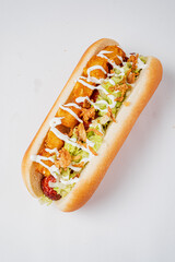 A delicious hot dog loaded with crunchy toppings and rich sauce, perfect for a quick bite