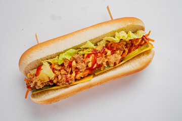 Vibrant sandwich packed with fresh lettuce, crunchy carrot, and zesty sauces