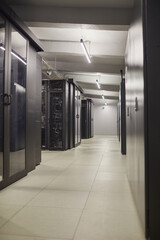 Spacious data center featuring advanced server units in sleek cabinets and enhanced ventilation for...