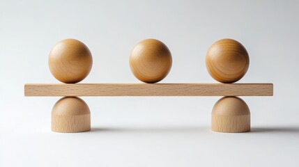 Wooden balancing spheres on a seesaw
