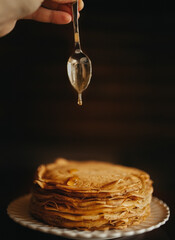 honey dripping from a spoon