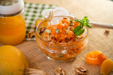 Cooked pumpkin porridge with rice, nuts and honey