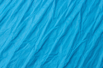Abstract wrinkled blue crumpled paper texture background