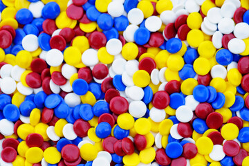 Colorful Round Game Pieces in Bright Red Yellow Blue White Mix