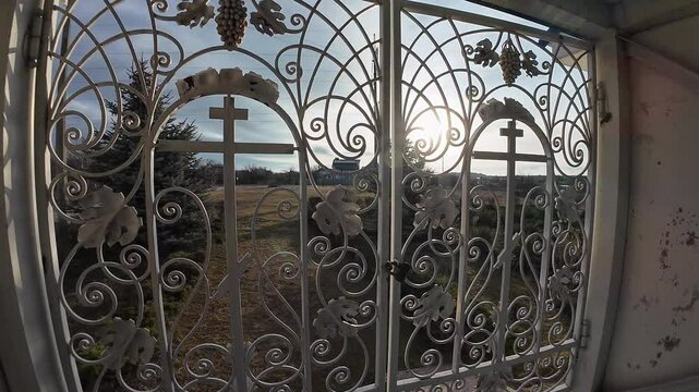 beautiful forged gates. Beautiful view of an old city architecture with stone stairs, columns, stucco moulding, plaster of paris. Grandiose forged gates, church gates.
