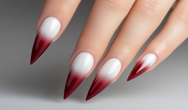 A beautiful girl working as a model exhibits her stylish red shellac nail polish, demonstrating the importance of cosmetics, beauty, and makeup