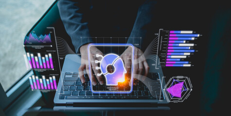 Businessman working on a laptop, interacting with digital analytics and visualizations, showcasing technology and data analysis.