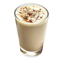 A full glass of creamy drink topped with spices on a black background isolated shot
