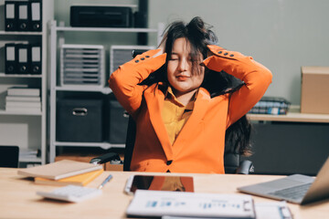 Asian women are stressed while working on laptop, Tired asian businesswoman with headache at...