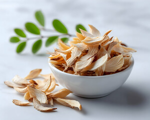 Dried lily flower petals in a bowl