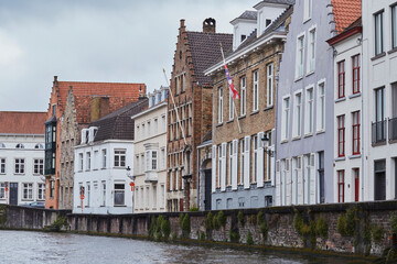 Naklejka premium Rainy day reflections in Bruges. Old town view from water.