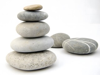 Fototapeta premium A stack of smooth gray and light gray stones arr
