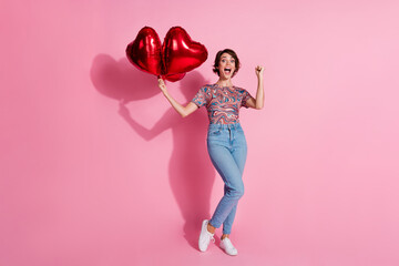 Photo of cheerfu glad nice cute girl wear stylish clothes rejoice glad win isolated on pink color...