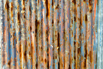 Textured Rusty Metal Surface with Blue and Orange Patina Details