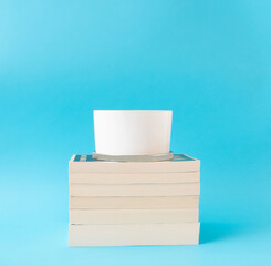 stack of books on blue background